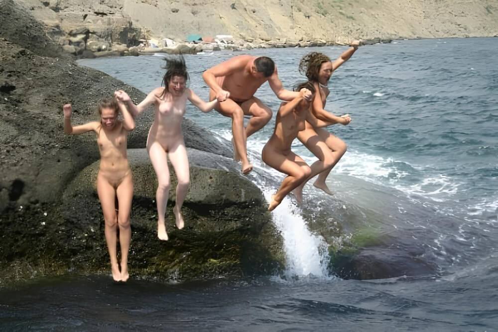 Mens and girls nudists on a beach - Love for oneself and nature as the foundation of the naturist lifestyle