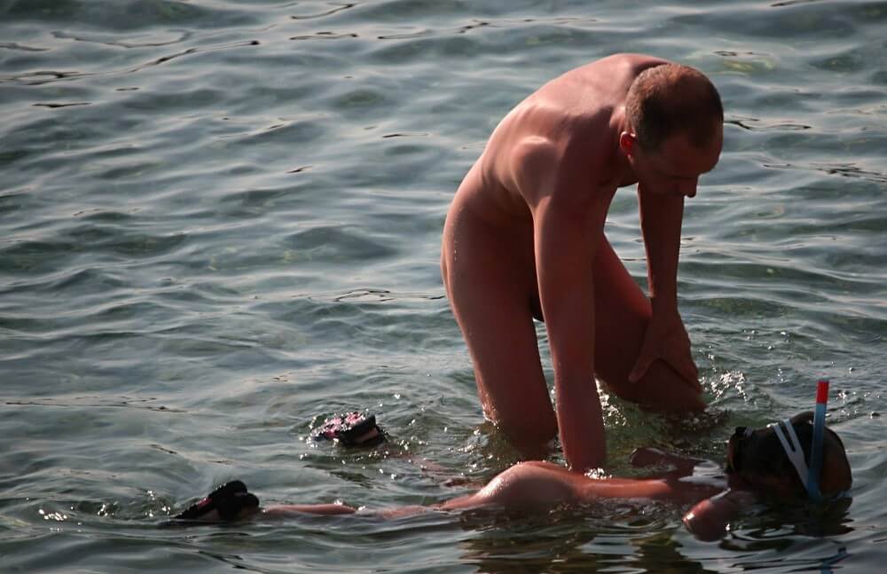 Father Floats His Daughter pics - A love for the sun and fresh air are important values for naturists